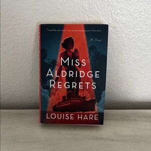 'Miss Aldridge Regrets' Novel - Red and Black Cover by Louise Hare